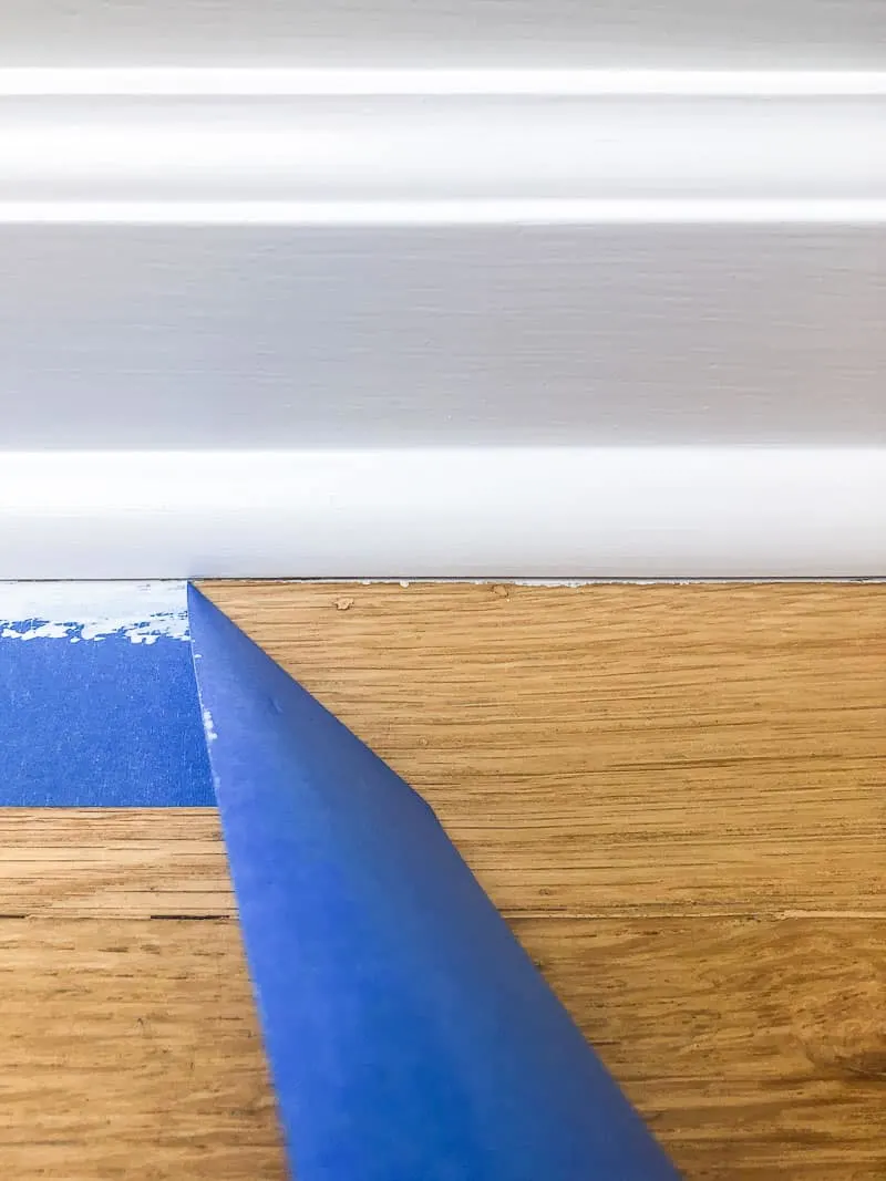 paint on hardwood floor under baseboards