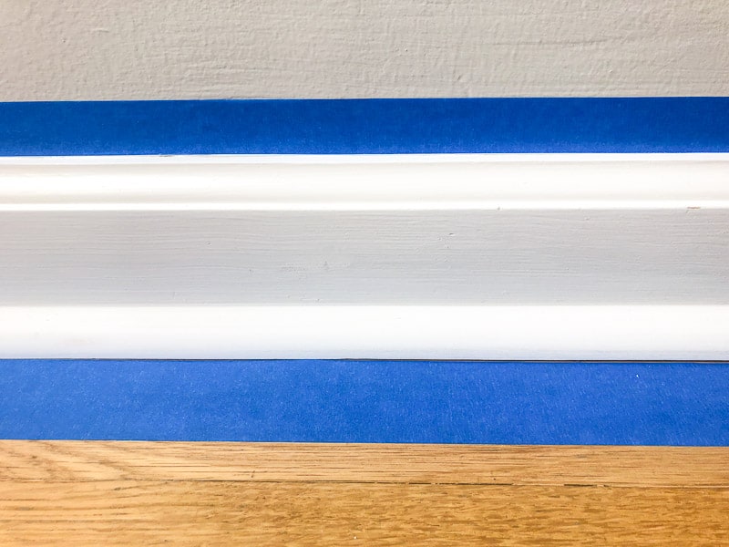 painter's tape above and below baseboards