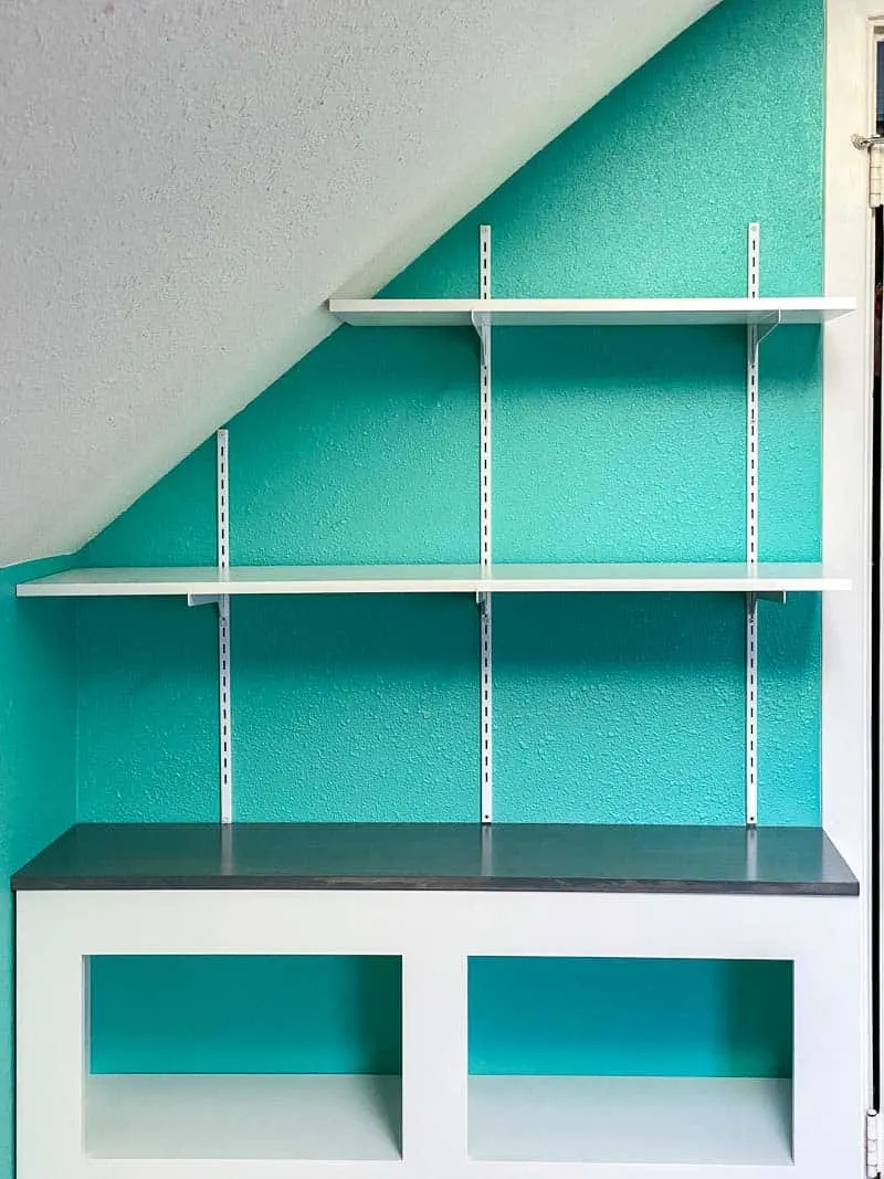 adjustable wall shelves installed on wall with sloped ceiling