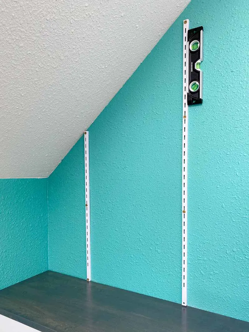 Adjustable wall mount shelves on angled wall
