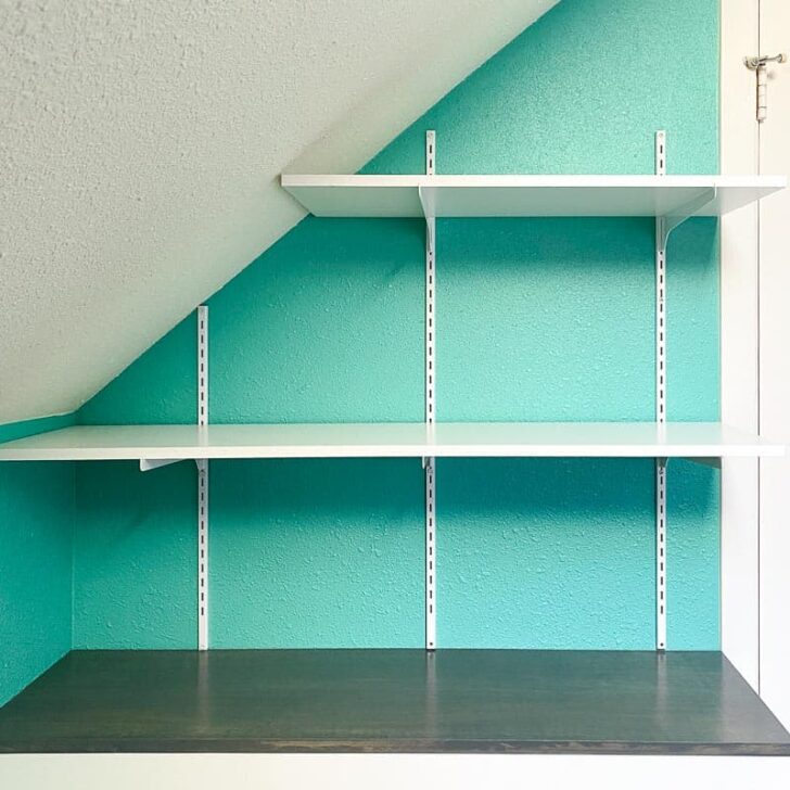 adjustable wall mounted shelving over built in cabinet