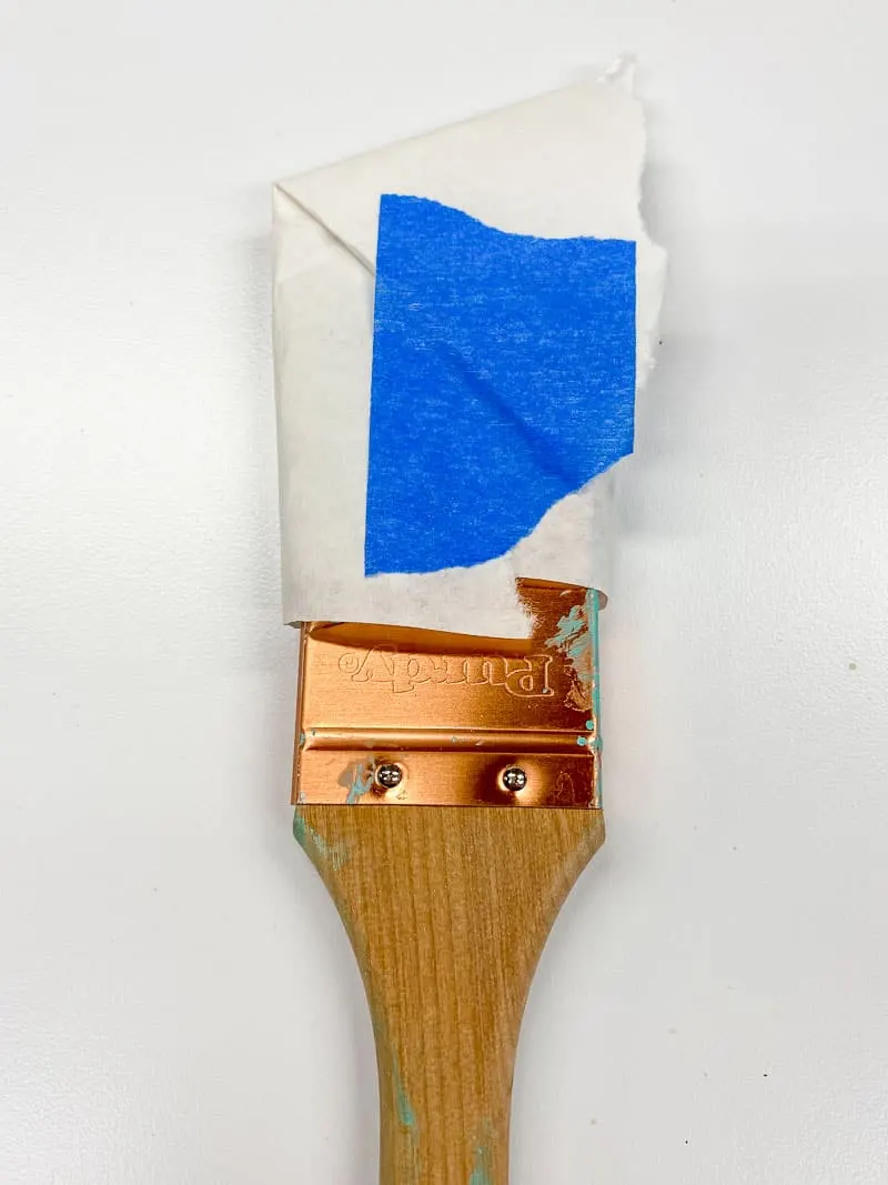 paint brush wrapped in paper after cleaning