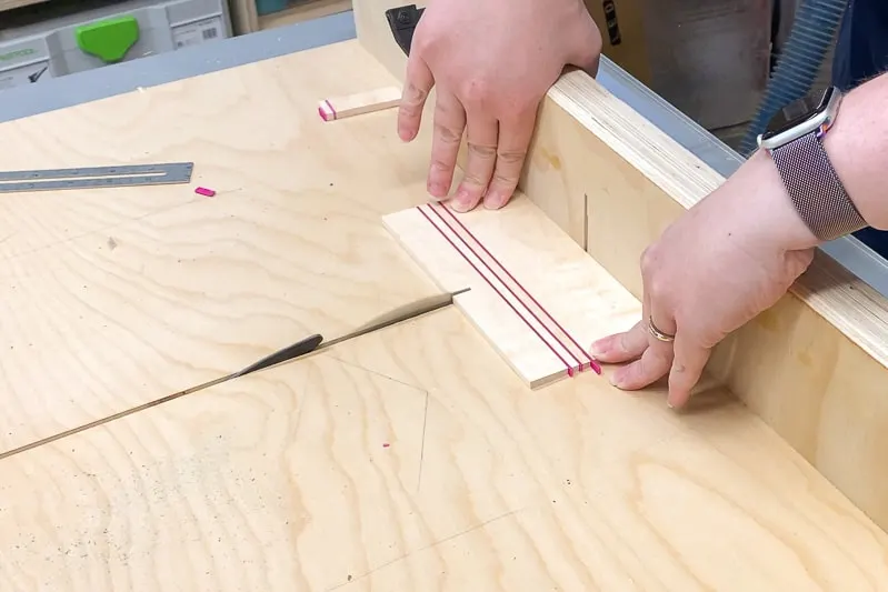 cutting out wood coasters on a table saw crosscut sled