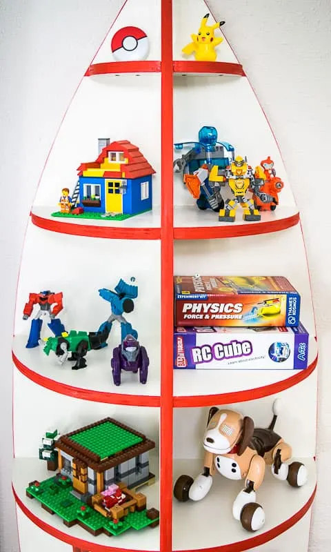 rocket bookshelf with toys on display