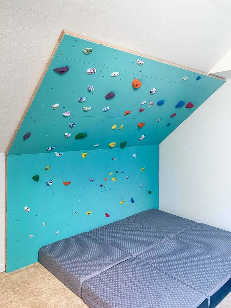 home climbing wall with foam mattress crash pads