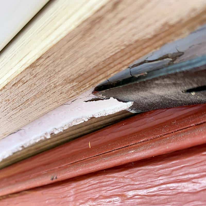 scraping paint off soffits and fascia before painting