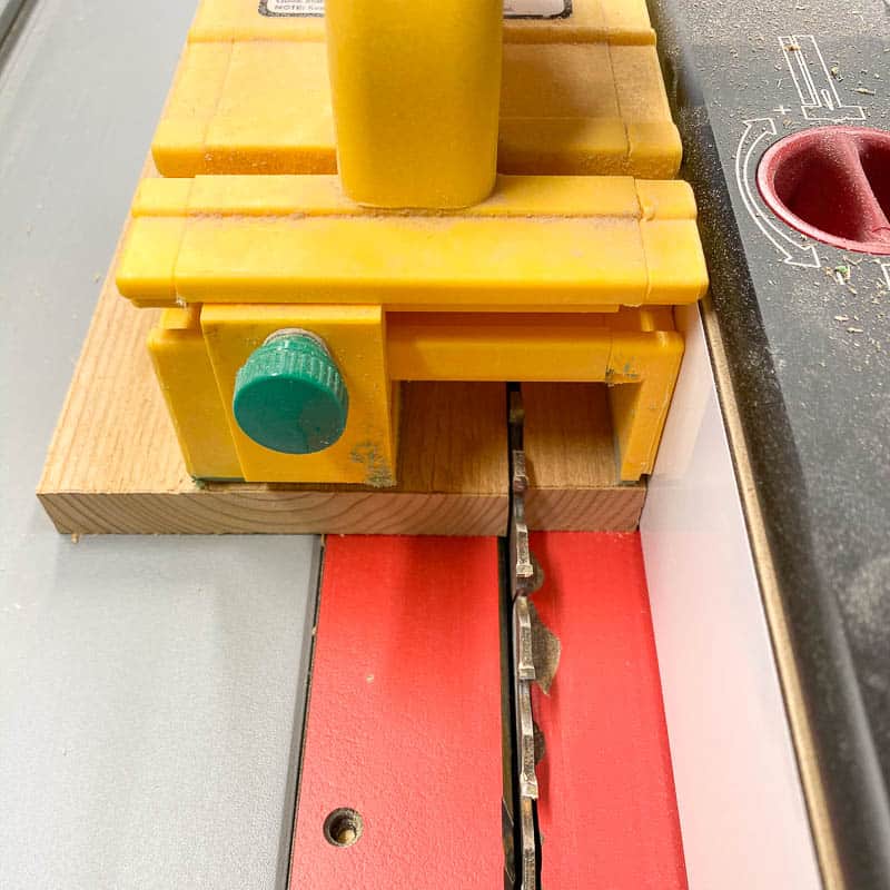 cutting cedar fence picket pieces with a table saw