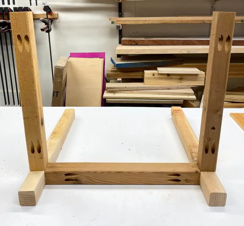 Attach the planter box legs to the frame with pocket hole screws.