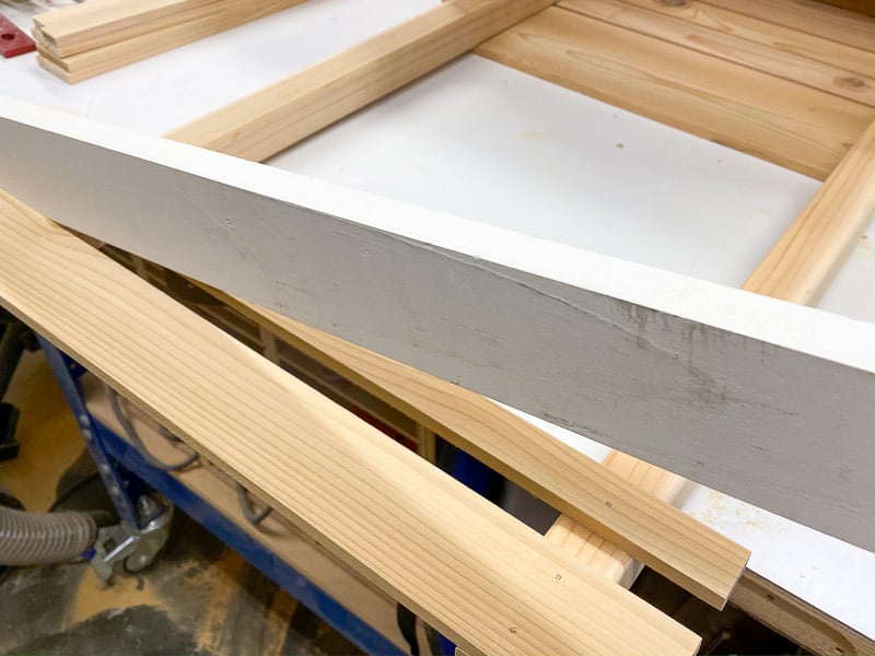 attaching the trellis slats onto the planter box