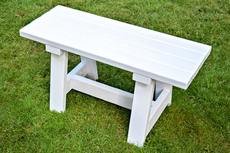 white 2x4 bench on grass