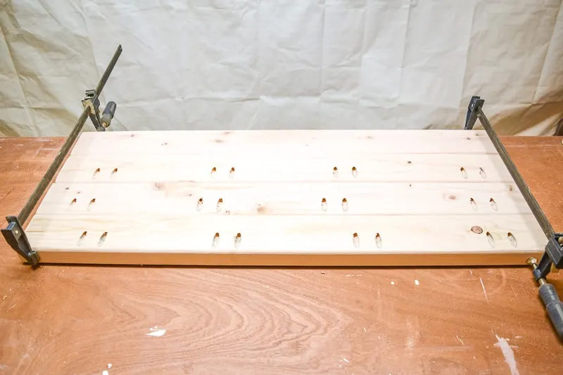 2x4 bench seat boards connected with pocket hole screws and clamps