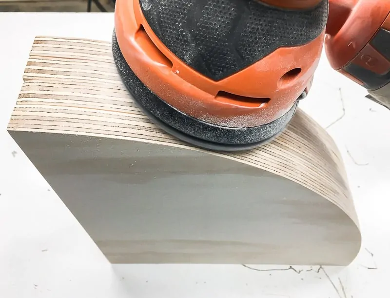 sanding edges of wooden circles
