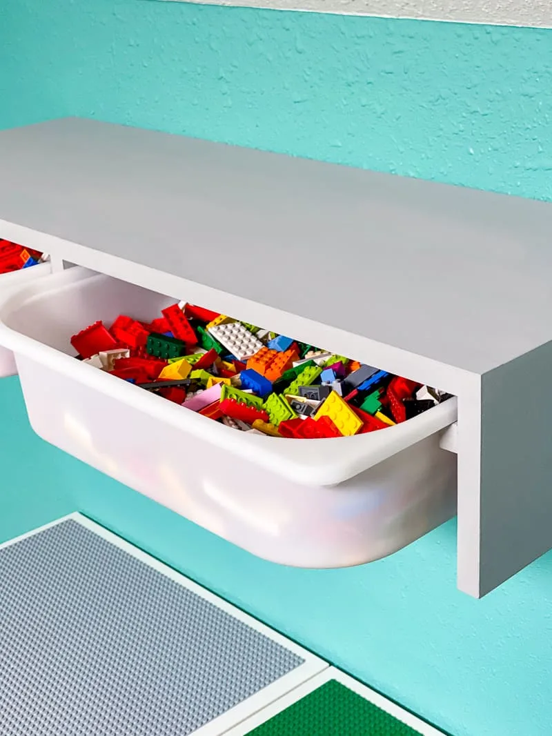IKEA Trofast shelf with bins full of Lego pieces