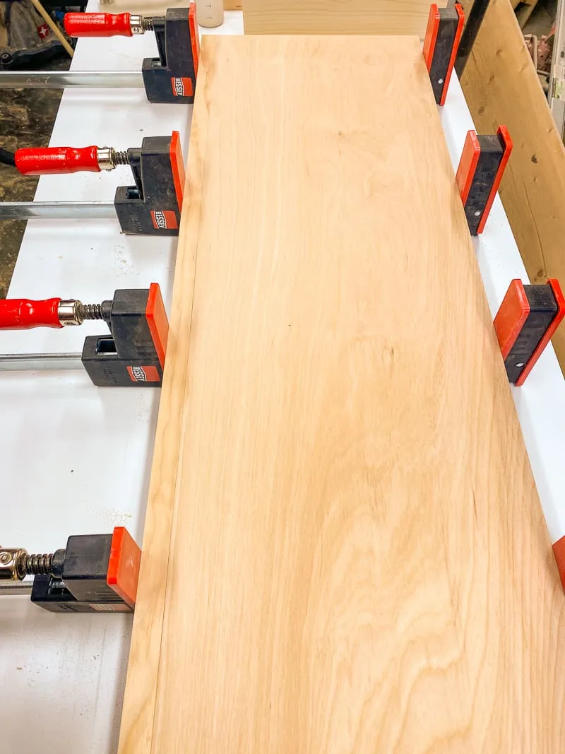 gluing a solid wood strip to the front of a plywood board