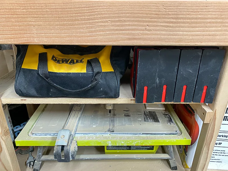 drill bag storage under miter saw stand