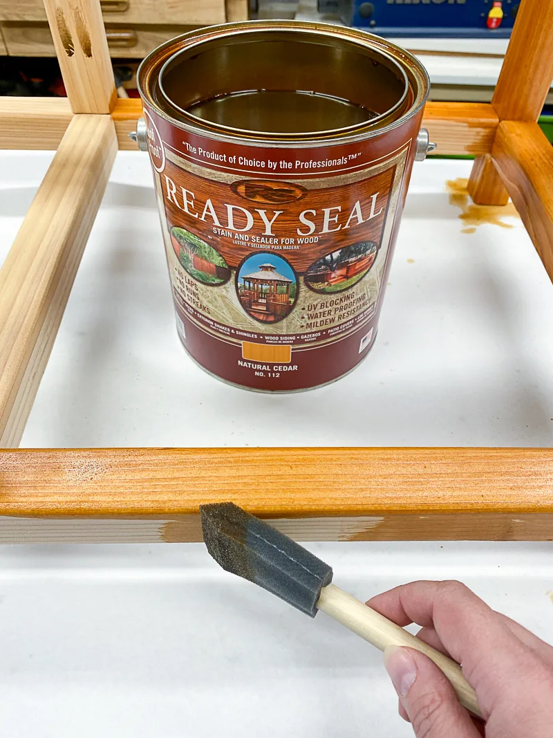 staining frame of DIY outdoor storage box with Ready Seal