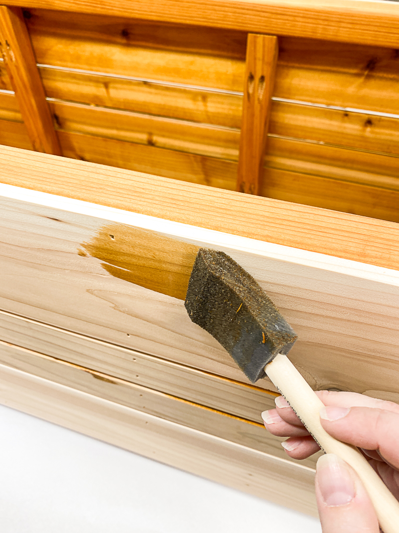 staining slats of outdoor storage box