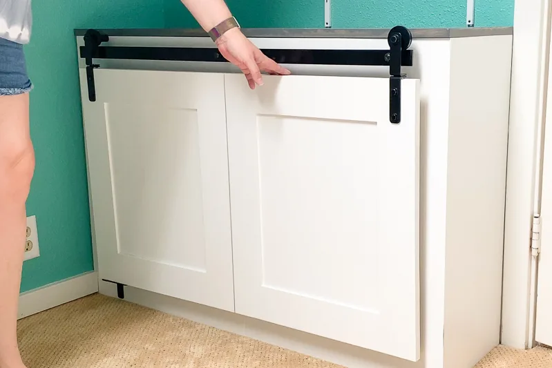 folding barn doors on built-in cabinet