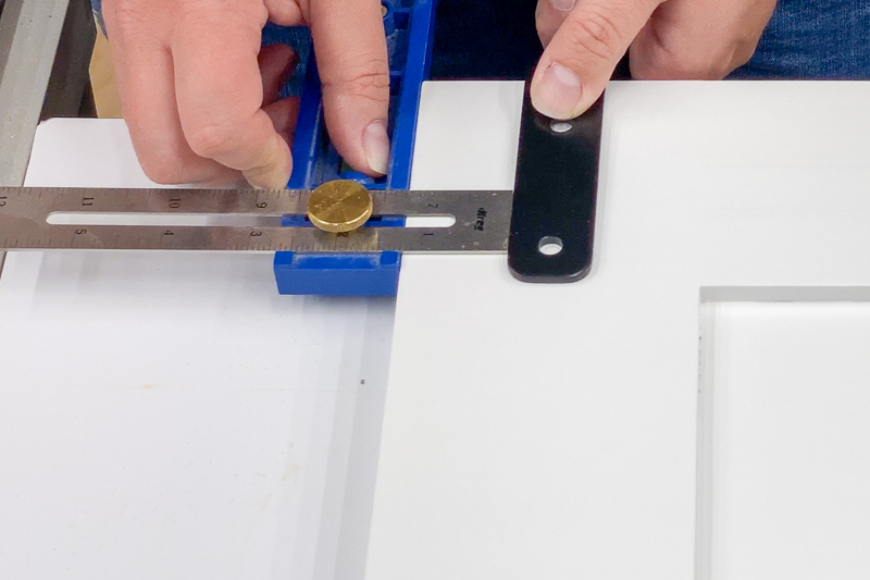 using Kreg Multi-Mark tool to get the right spacing for the bifold barn door hardware