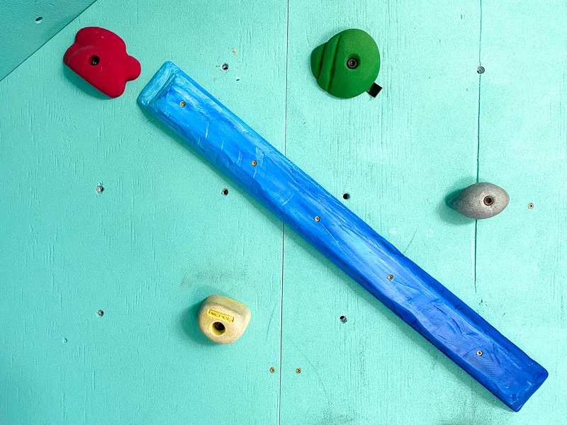 wooden climbing hold on DIY climbing wall