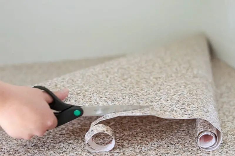 cutting patch out of leftover countertop contact paper