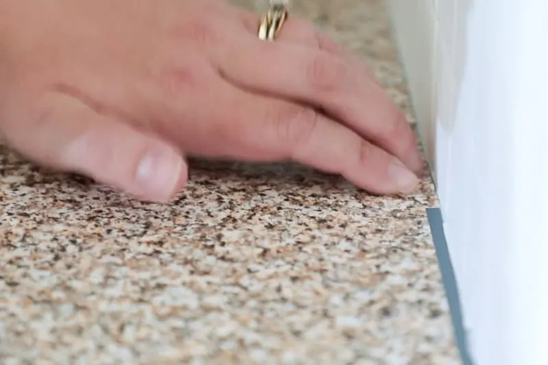 fixing gap between backsplash and countertop with extra contact paper