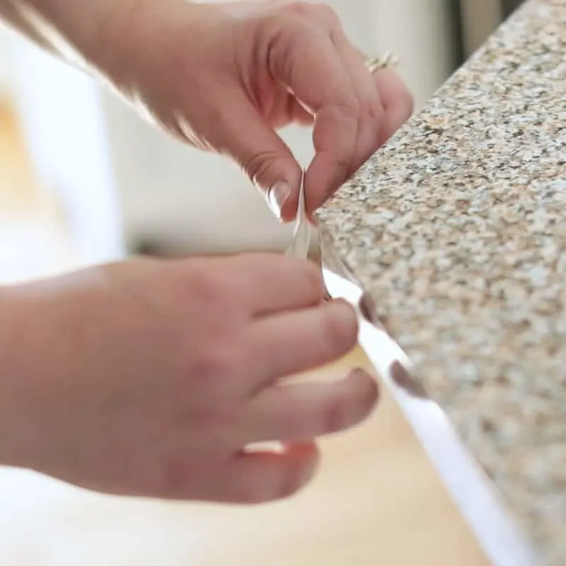 applying patch to corner of contact paper countertop