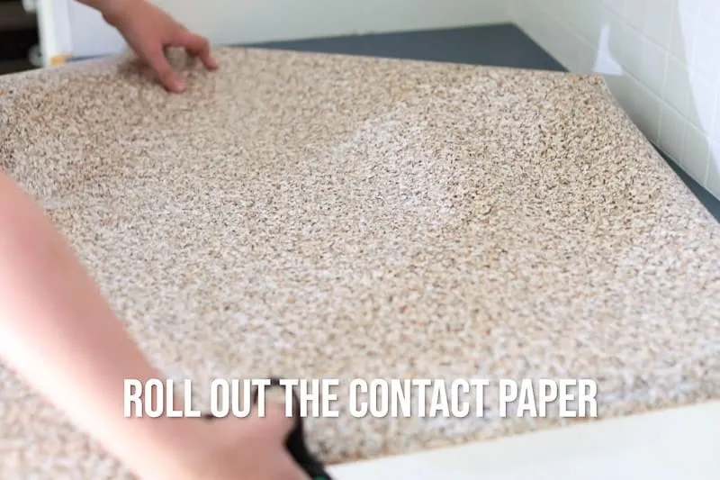 roll out contact paper over countertop to cut to size