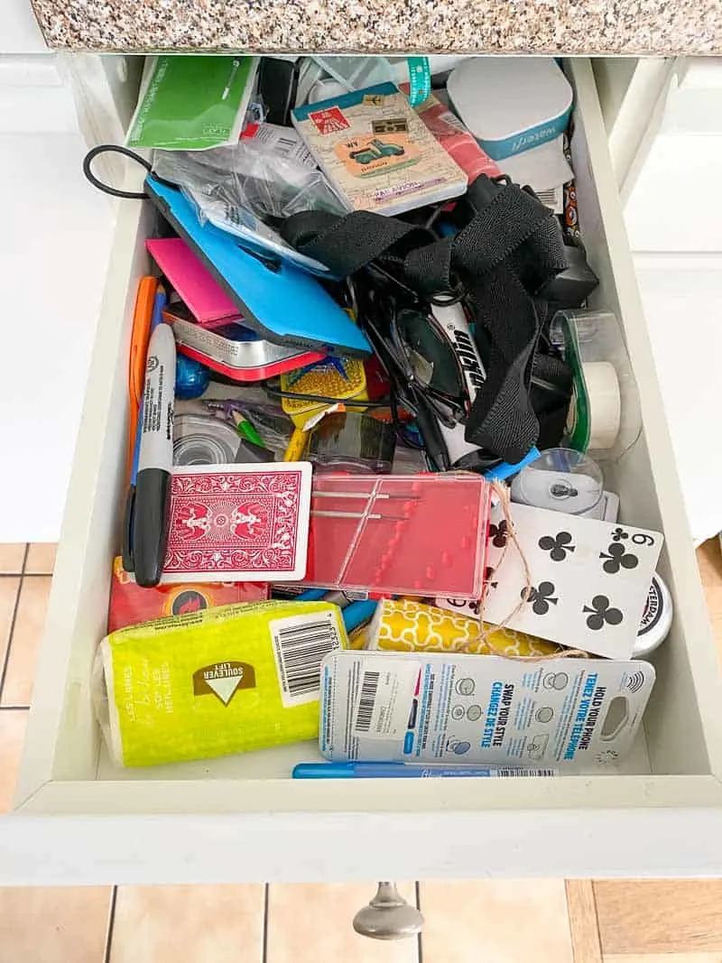 cluttered junk drawer in kitchen
