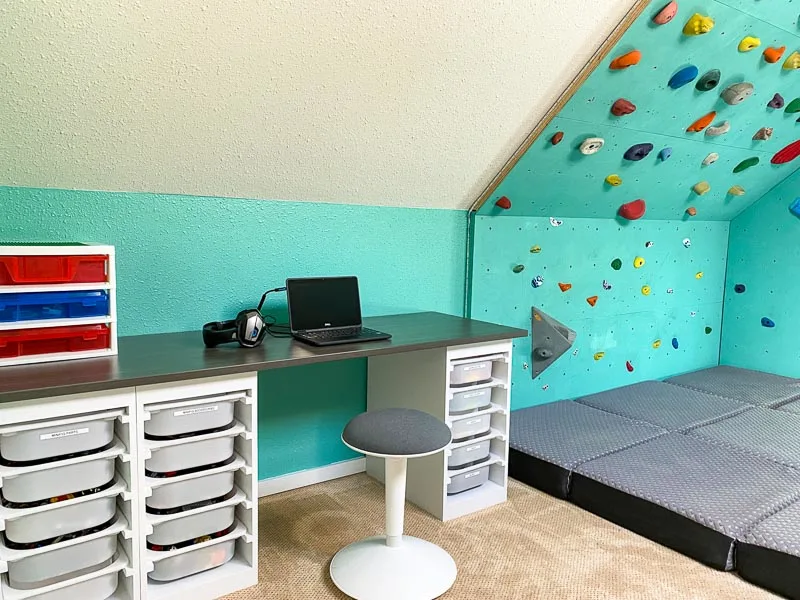 bedroom with climbing wall and Lego desk