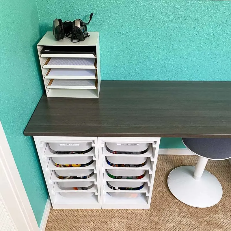 paper tray in corner of Lego desk for school supplies