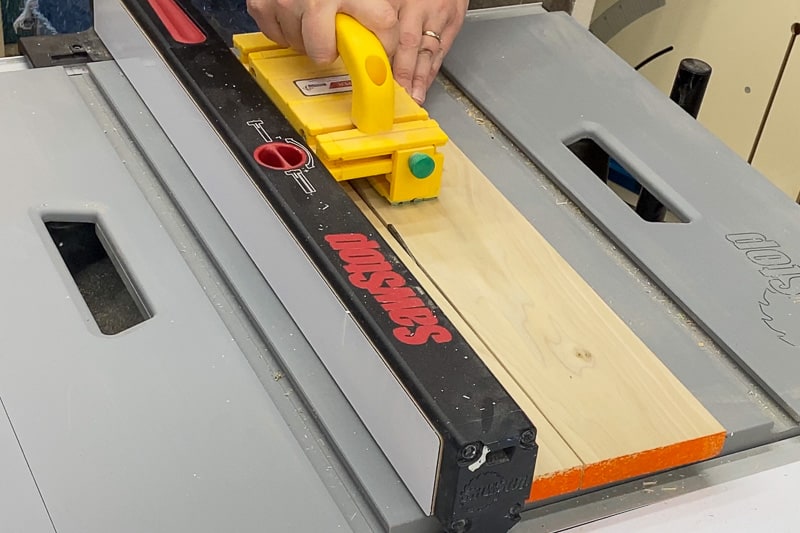 cutting sides of Lego tray to size at the table saw