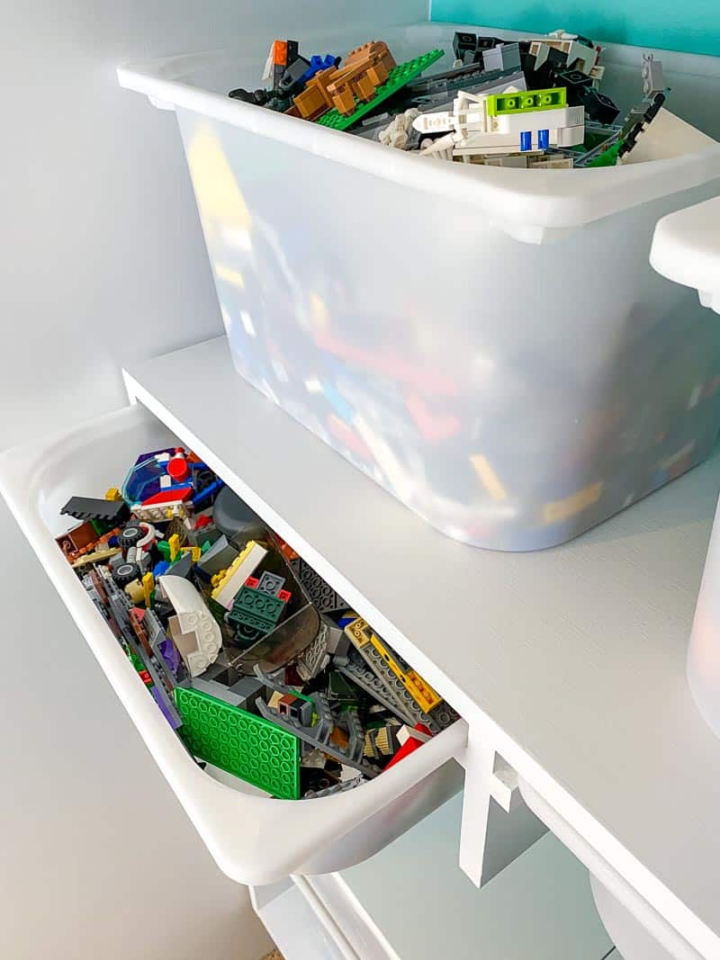 French cleat system holding shelves with bins above and below