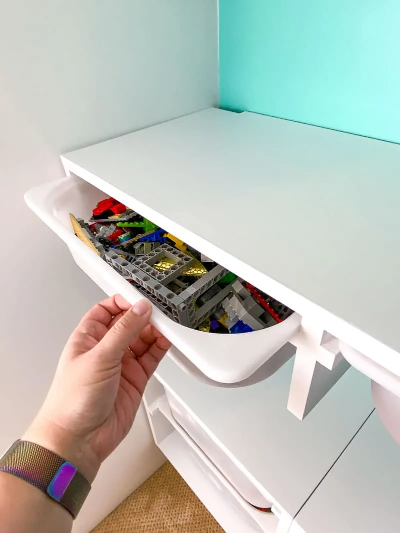 pulling out storage bin under floating IKEA shelf