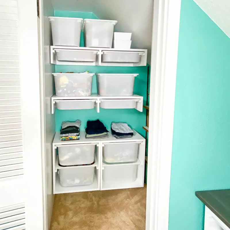 DIY custom closet with storage bins and shelves