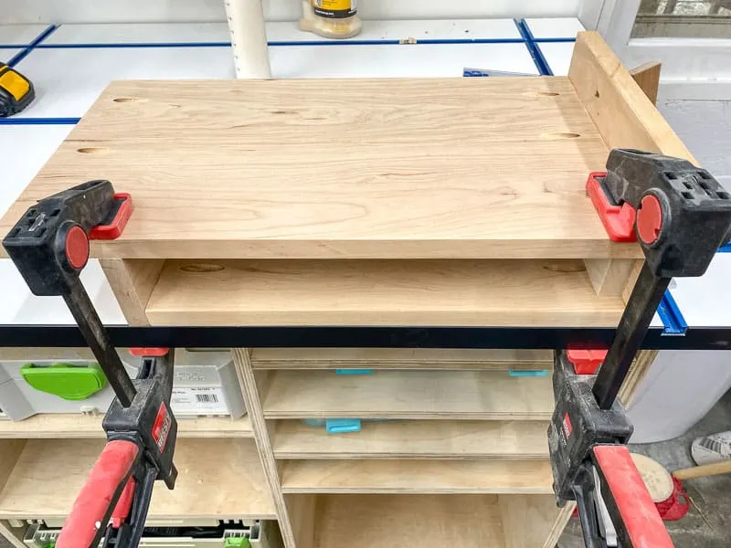 attaching shelf to the underside of the laptop stand