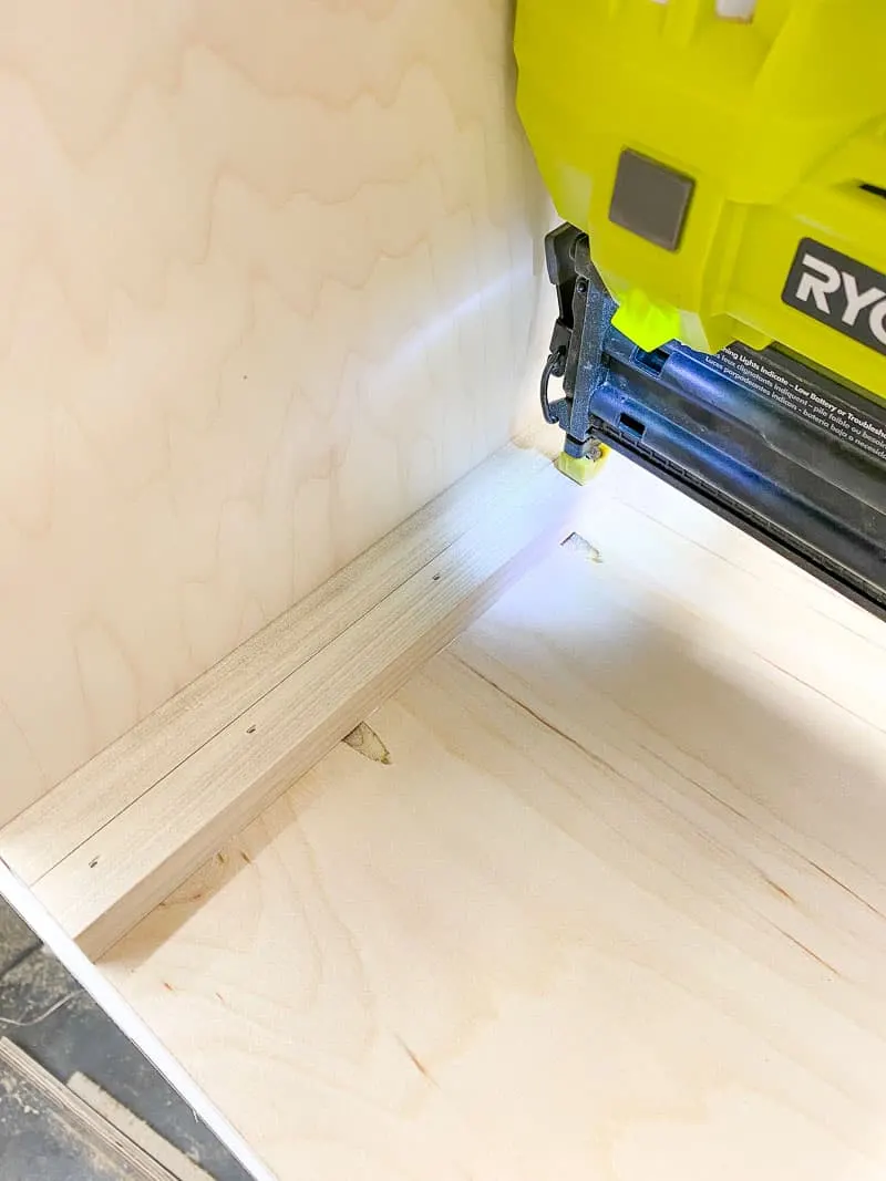 using a spacer to attach the drawer runners on the inside of the storage bin frame