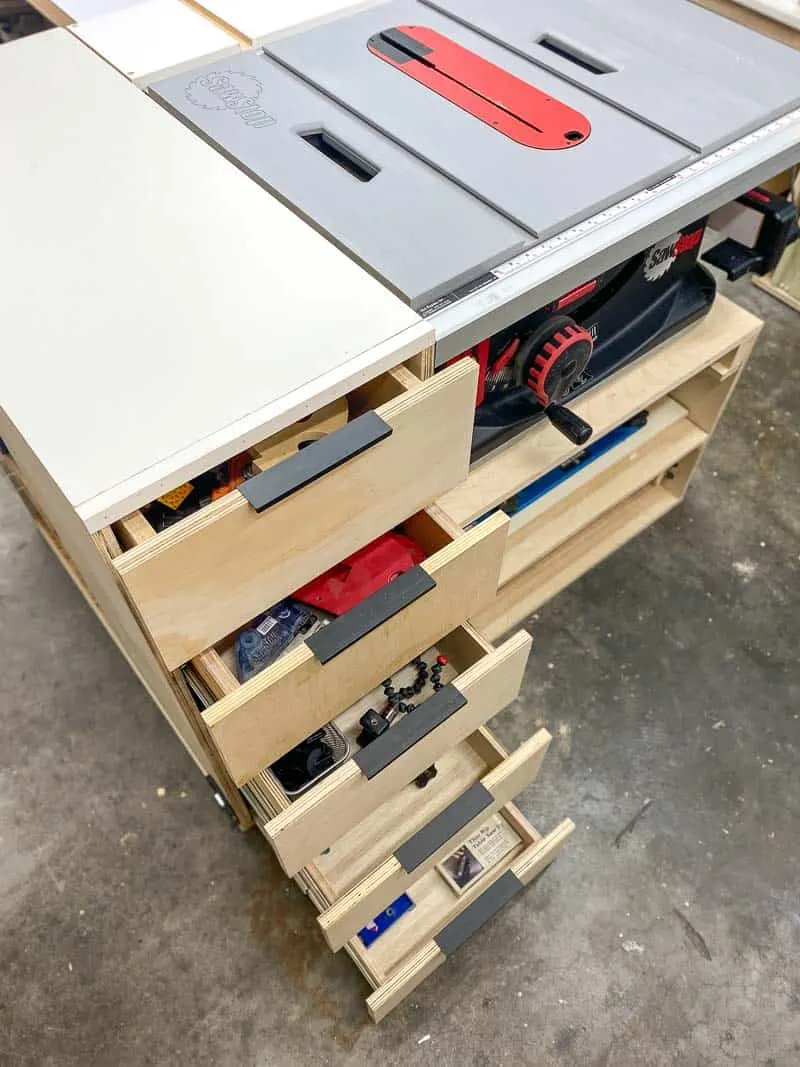 DIY table saw stand with drawers open