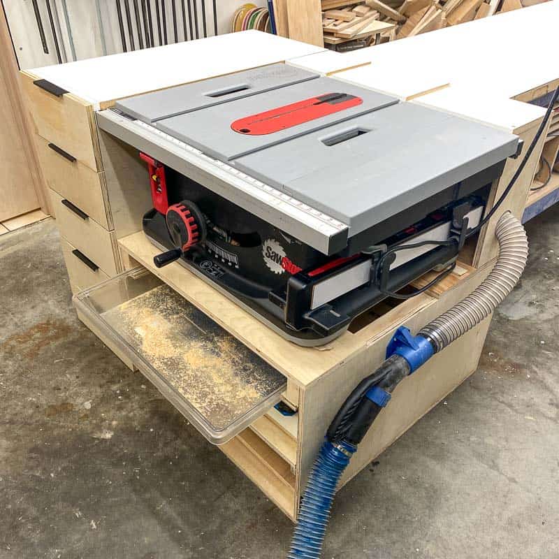 table saw stand with dust port and dust tray