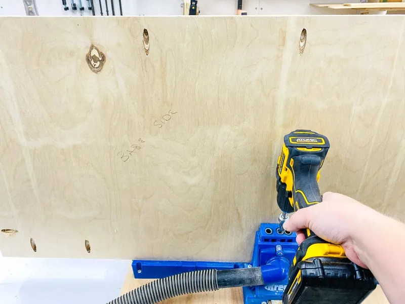 drilling pocket holes in one board of the table saw table