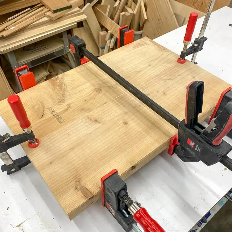 two boards joined together with wood glue and clamps