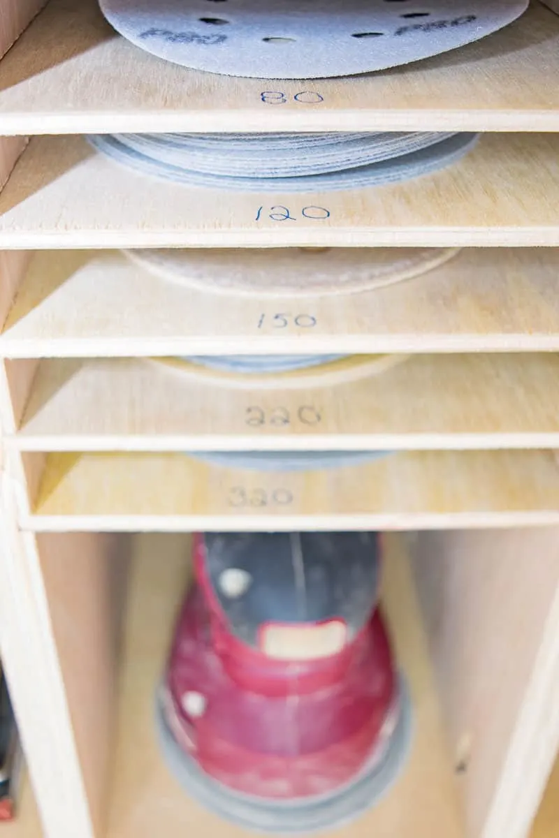 sandpaper storage shelves with each grit labeled