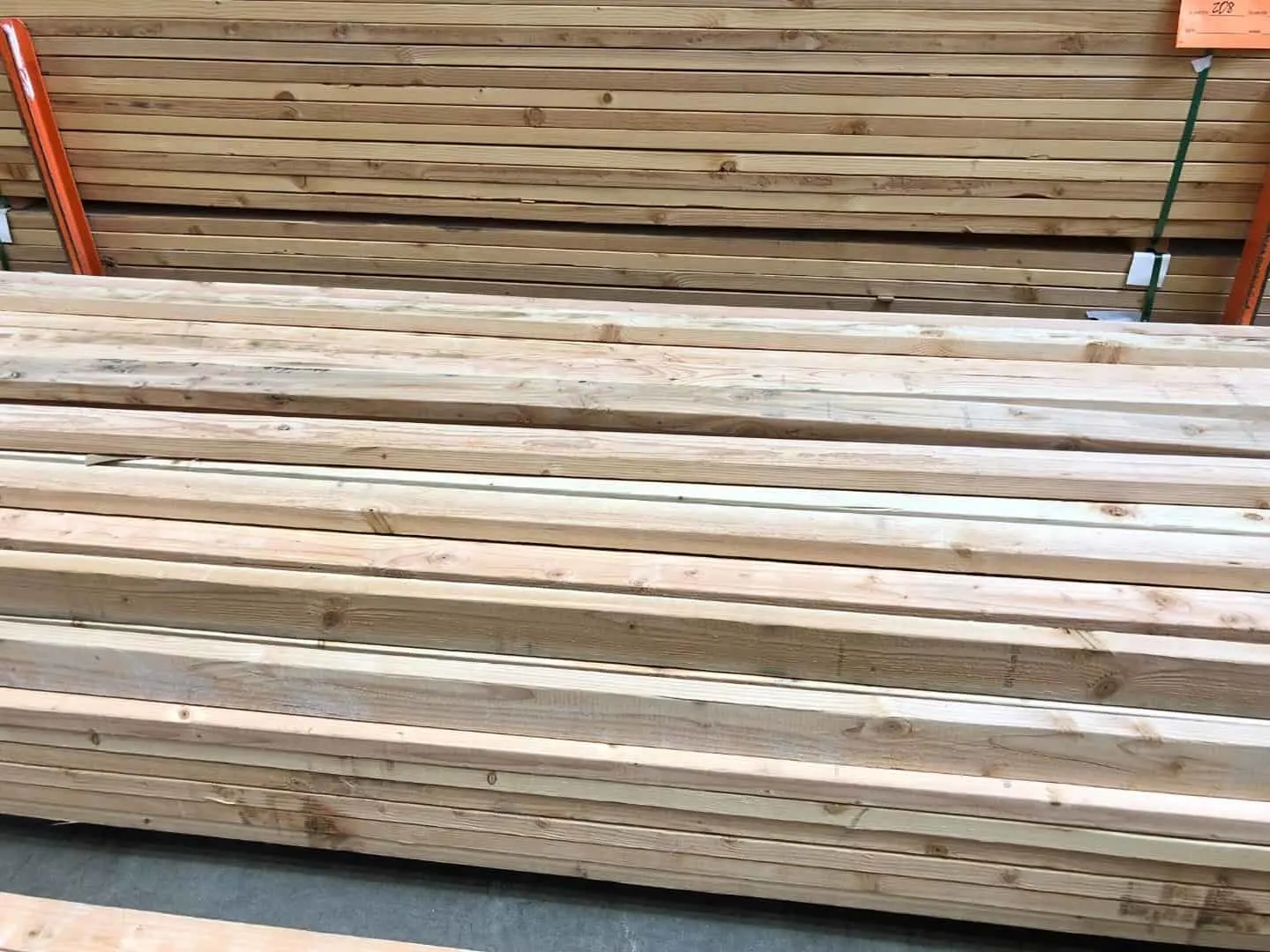 stack of 2x4 lumber at the home improvement store