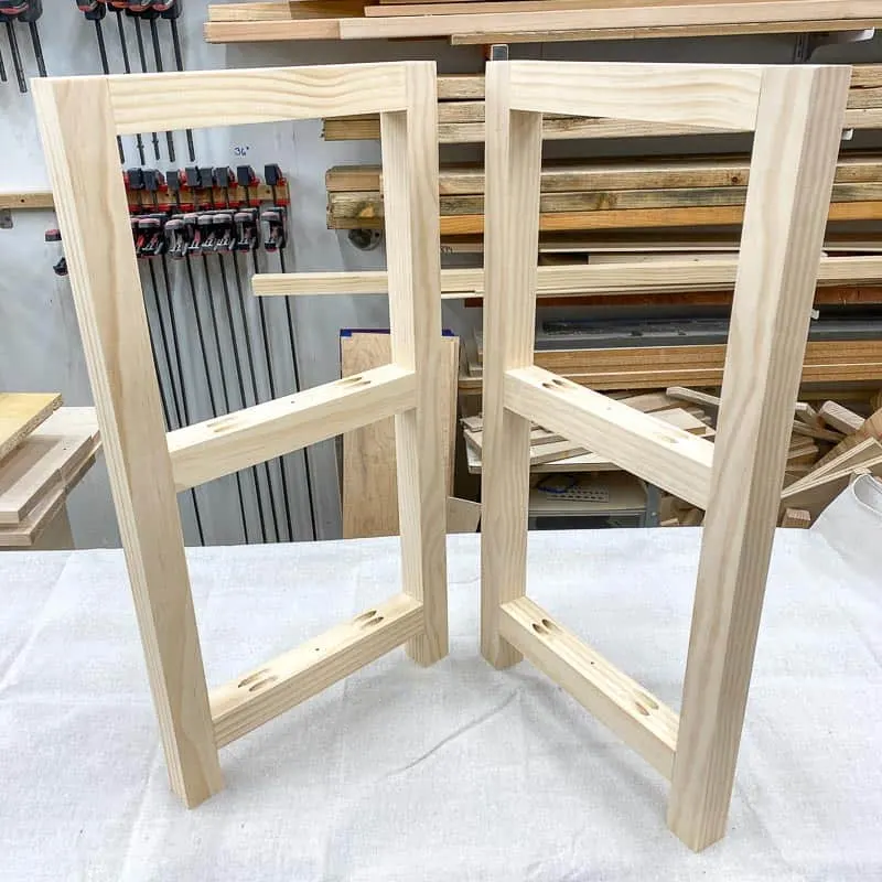 legs of a DIY rustic end table on a workbench
