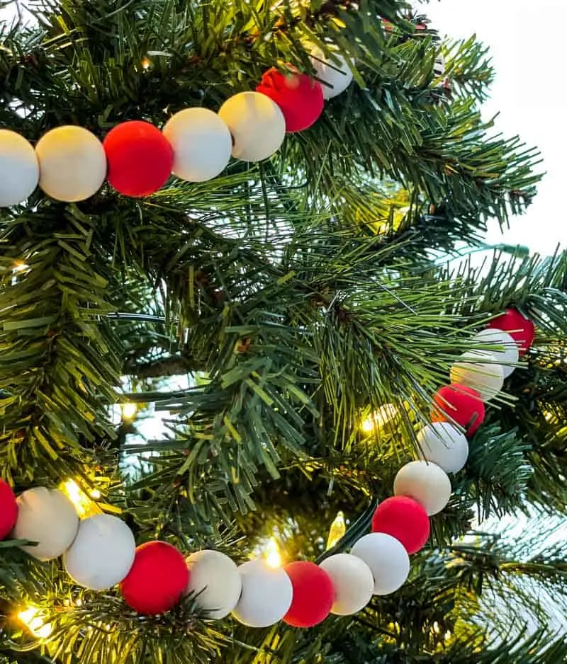 DIY farmhouse wood bead garland in Christmas tree