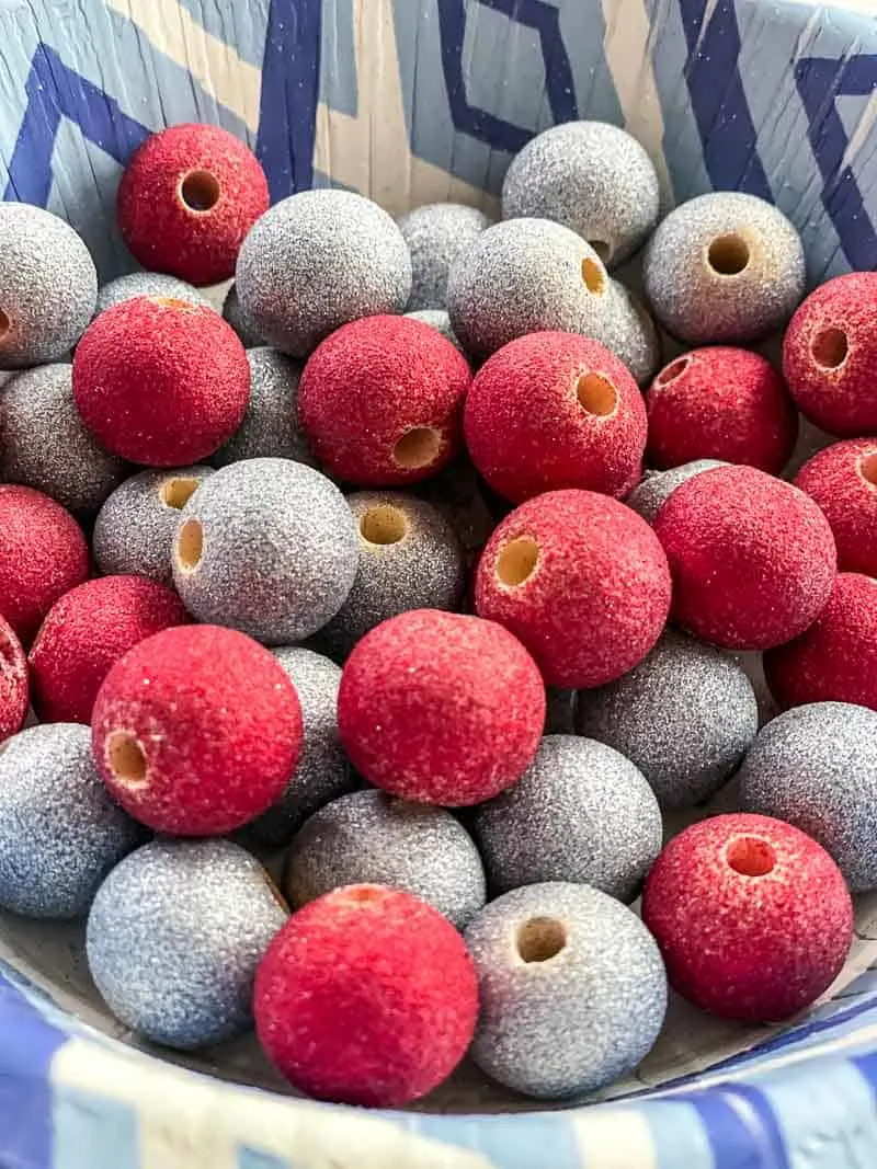 wooden beads painted with red and silver glitter spray paint