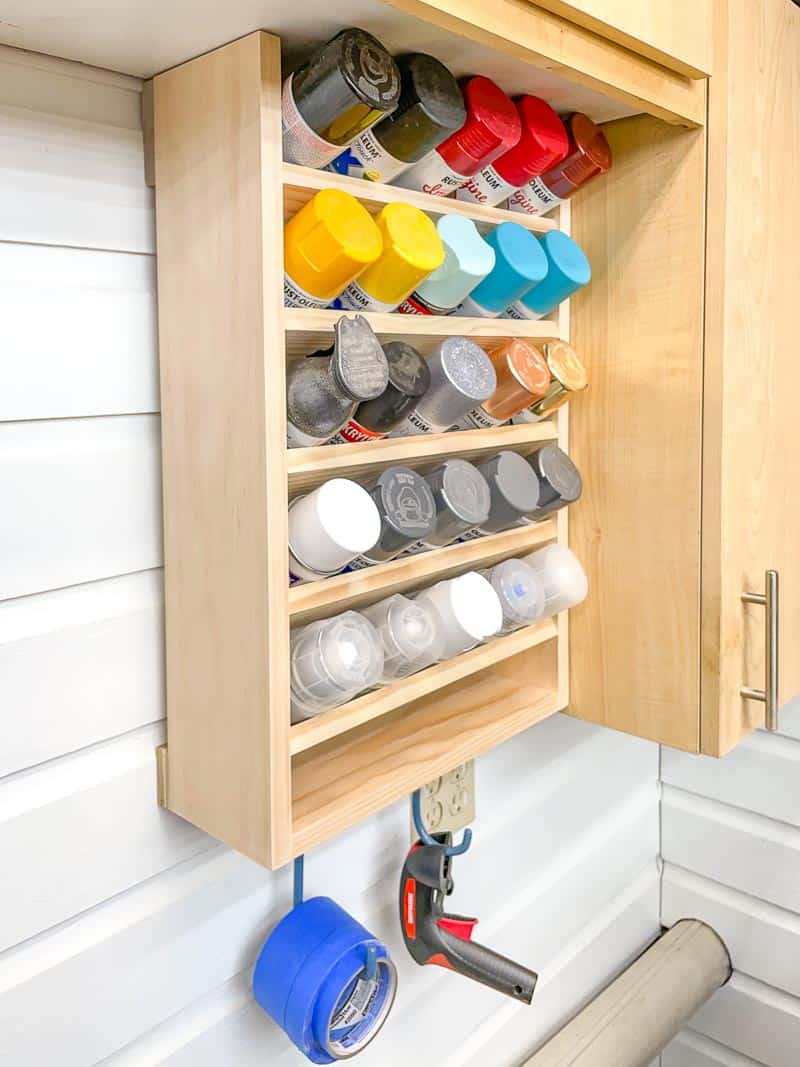 spray paint rack filled with different colored cans