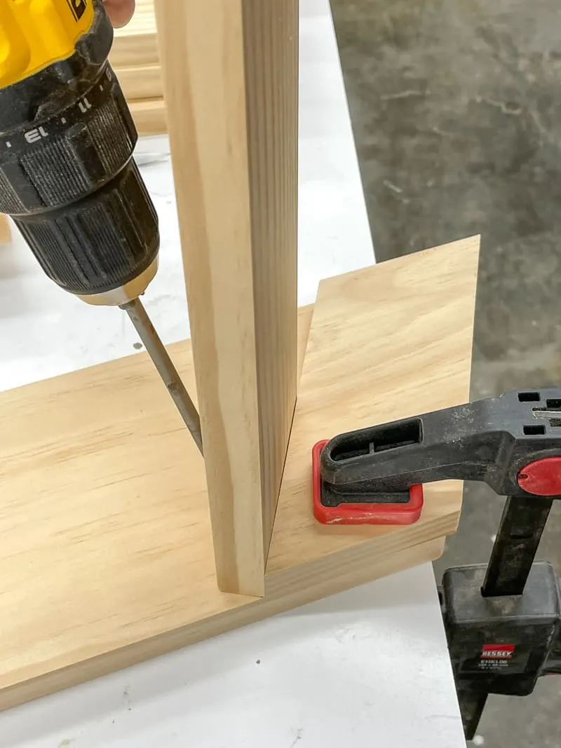 attaching first shelf of spray paint storage rack with pocket hole screws