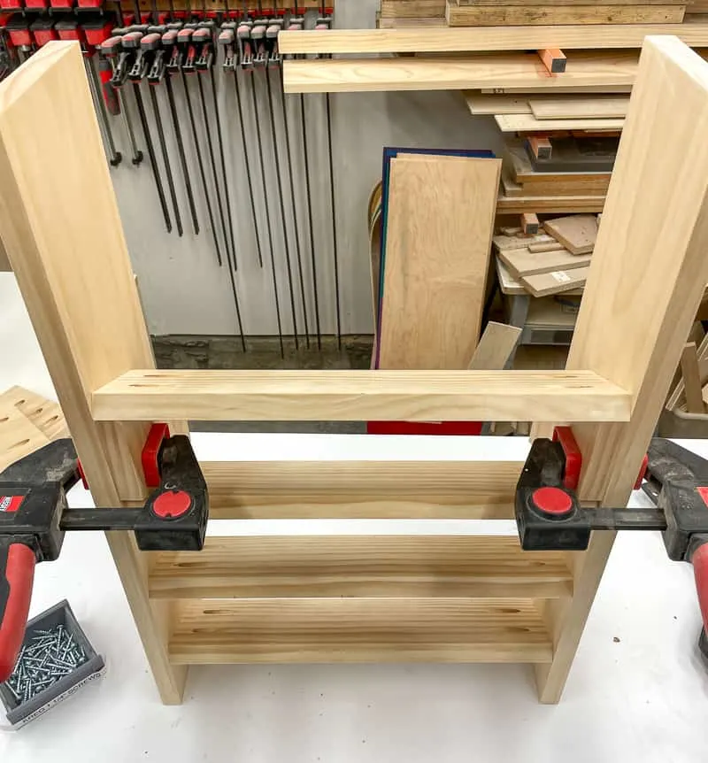 spray paint storage rack shelves being installed with pocket hole screws