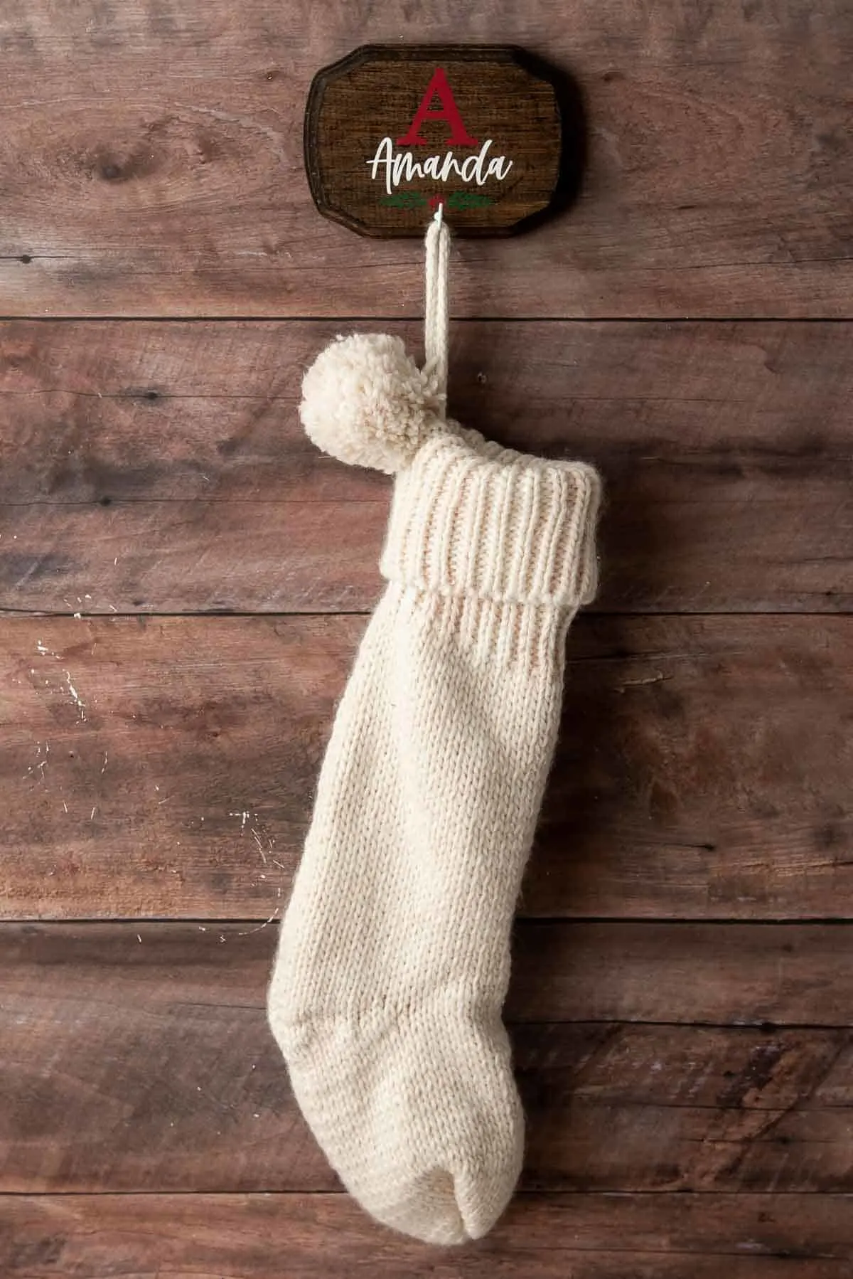 personalized DIY wall mount stocking hanger with knit stocking on wall